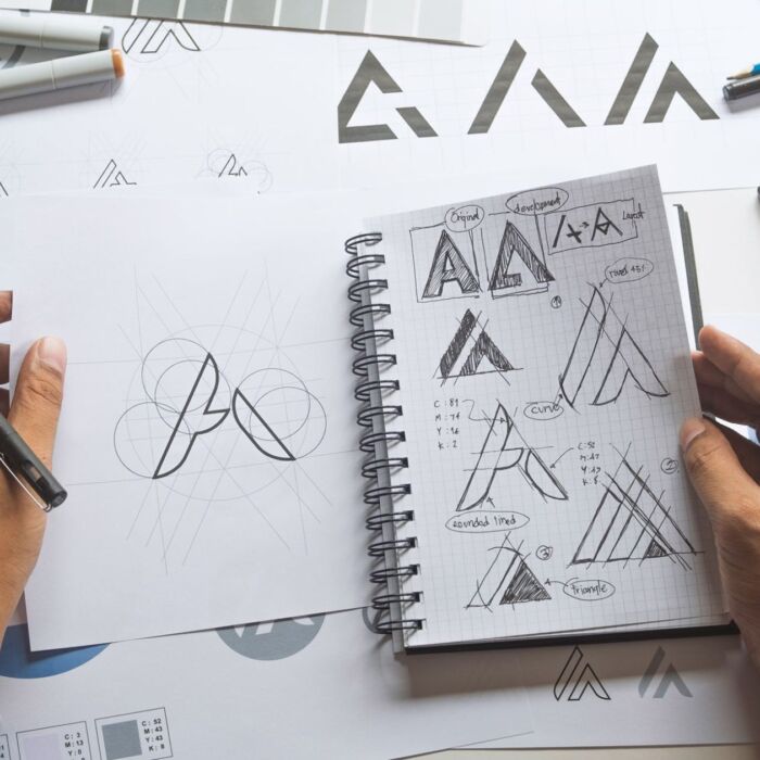 Graphic designer drawing sketch design creative Ideas draft Logo